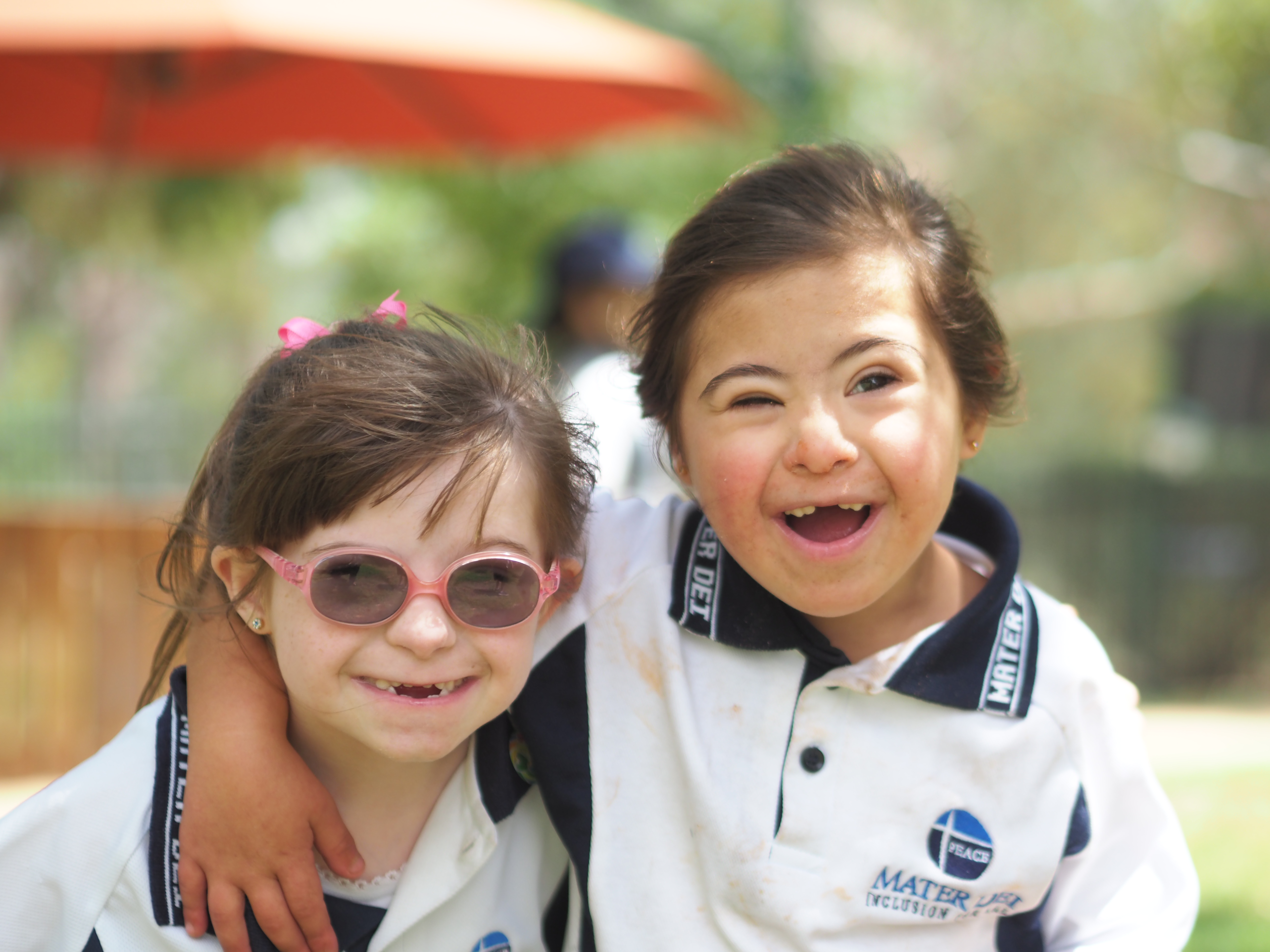 Two students playing in the playground.