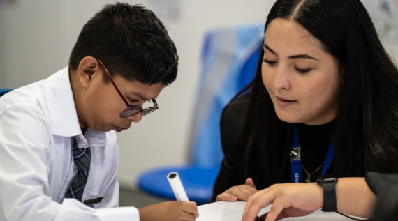 A teacher guiding a student through their work.