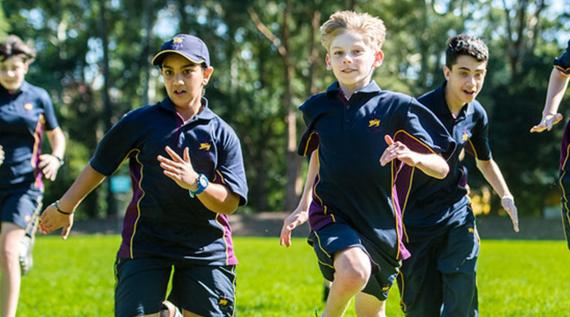 Kids running on the school oval.