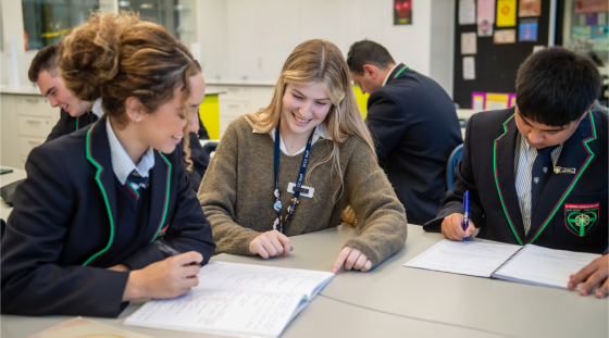 A teaching in a high school classroom.