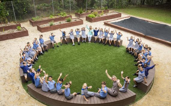 A group of students sitting in a big circle.