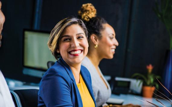 A woman working at a desk.