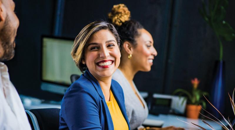 A woman working at a desk.